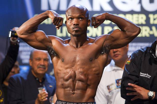 Undefeated WBO welterweight champion Timothy Bradley Jr.  flexes on the scale during an official weigh-in at the Wynn Las Vegas Friday, Oct. 11, 2013. Bradley will defend his title against Juan Manuel Marquez of Mexico at the Thomas & Mack Center on Saturday.