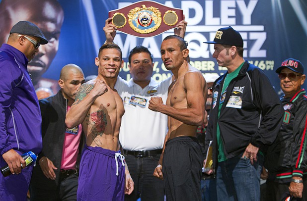 Featherweight boxers Orlando Cruz, left, of Puerto Rico and Orlando Salido of Mexico pose during an official weigh-in at the Wynn Las Vegas Friday, Oct. 11, 2013. Cruz, boxing's first openly gay fighter, and Salido will fight for a vacant WBO featherweight championship at the Thomas & Mack Center on Saturday.