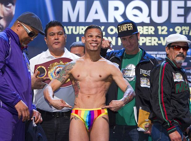 Featherweight boxer Orlando Cruz of Puerto Rico poses during an official weigh-in at the Wynn Las Vegas Friday, Oct. 11, 2013. Cruz, boxing's first openly gay fighter, and Orlando Salido of Mexico will fight for a vacant WBO featherweight championship at the Thomas & Mack Center on Saturday.