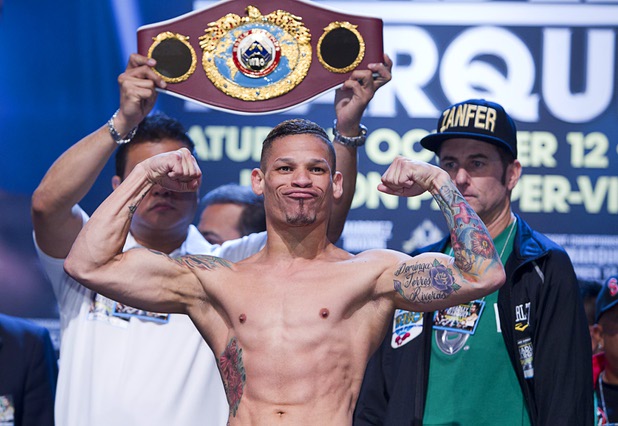Featherweight boxer Orlando Cruz of Puerto Rico poses during an official weigh-in at the Wynn Las Vegas Friday, Oct. 11, 2013. Cruz, boxing's first openly gay fighter, and Orlando Salido of Mexico will fight for a vacant WBO featherweight championship at the Thomas & Mack Center on Saturday.