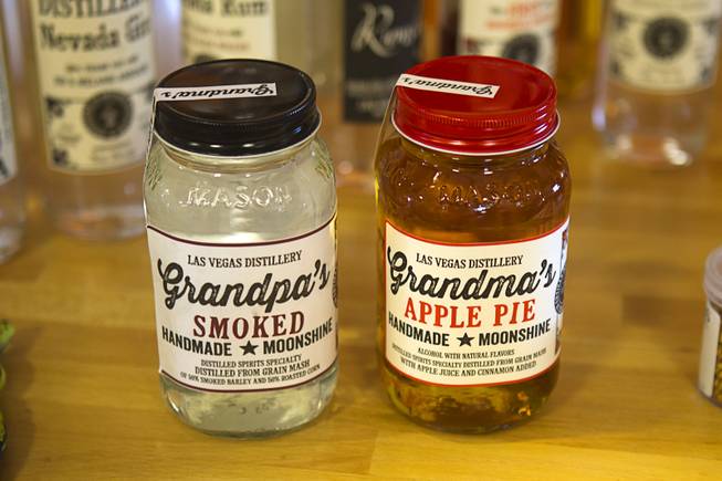 The Las Vegas Distillery's newest spirit, right, Grandma's Apple Pie Moonshine, is shown during a tasting at the distillery in Henderson Saturday, Oct. 12, 2013. Grampa's Smoked Moonshine will be available soon, said distillery owner George Racz. The distillery will feature additional tastings on Oct. 19 and 26.