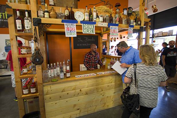 Guests sample spirits during tastings at the Las Vegas Distillery in Henderson Saturday, Oct. 12, 2013. The distillery unveiled their newest spirit called Grandma's Apple Pie Moonshine. The distillery will feature additional tastings on Oct. 19 and 26.