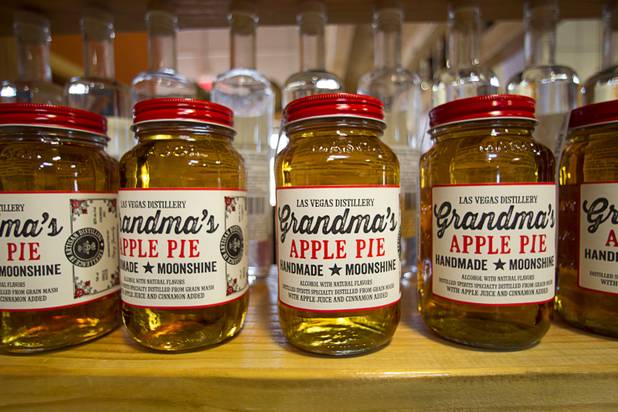 Mason jars of the Las Vegas Distillery's newest spirit, Grandma's Apple Pie Moonshine, are displayed during an unveiling and tasting at the distillery in Henderson Saturday, Oct. 12, 2013. The distillery will feature additional tastings on Oct. 19 and 26.