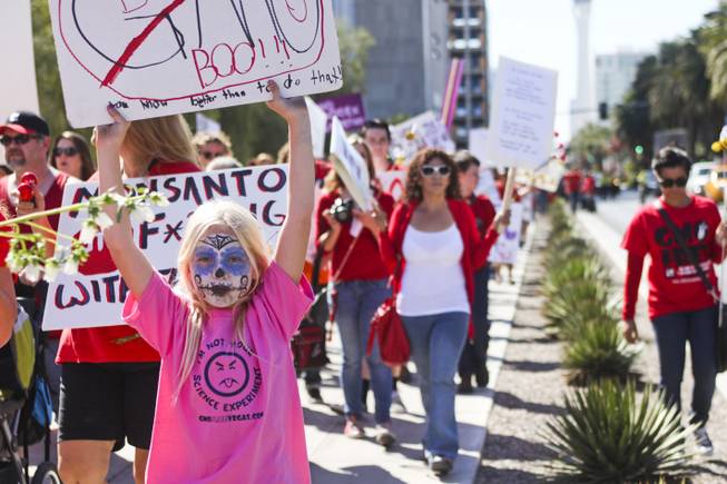 Protesters leave the U.S. district courthouse during the "March Against Monsanto" protest opposing genetically modified food in downtown Las Vegas, Saturday, Oct. 12, 2013.