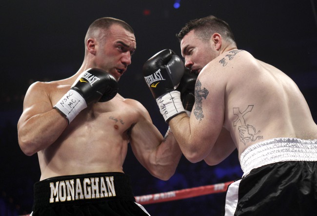 Irish-American boxer Sean Monaghan (L) of New York connects with a punch on Anthony Smith of Pennsylvania during their light heavyweight bout at the Thomas & Mack Center in Las Vegas, Nevada, October 12, 2013. Monaghan won the fight with a third round TKO. REUTERS/Richard Brian (UNITED STATES)