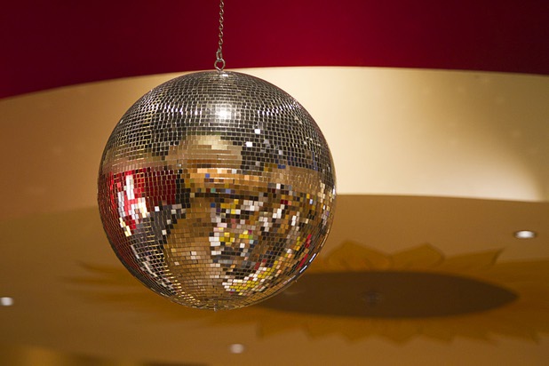 A disco ball turns during a class at the Buzz'N Brushes art studio in the Orleans Sunday, Oct. 13, 2013.  The studio combines art and entertainment for beginners and shares space with a bar and pizza kitchen.