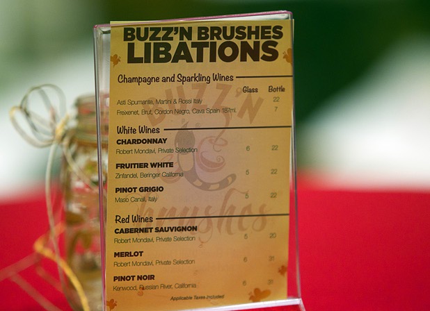 A drink menu is shown during a class at the Buzz'N Brushes art studio in the Orleans Sunday, Oct. 13, 2013.  The studio combines art and entertainment for beginners and shares space with a bar and pizza kitchen.