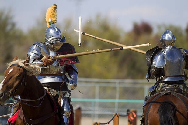 Lances break as Knights of Mayhem Charlie Andrews, left, and Steven Weems joust on the Field of Honor during the Age of Chivalry Renaissance Festival at Sunset Park Sunday, Oct. 13, 2013.