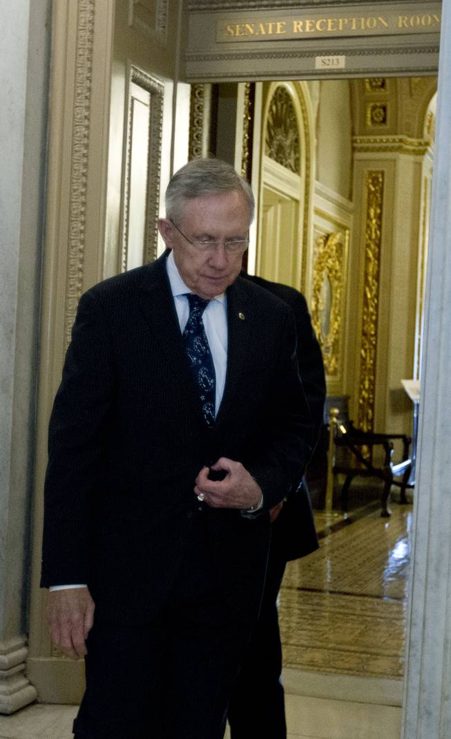 Senate Majority Leader Harry Reid of Nevada walks to the elevators Sunday, Oct. 13, 2013. Senate Republicans and Democrats hit an impasse Sunday over spending in their last-ditch struggle to avoid an economy-jarring default in just four days and end a partial government shutdown that's entering its third week.