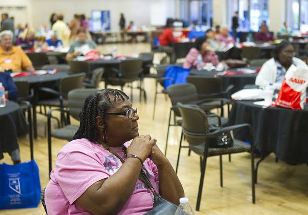 Anna (no last name given) listens to speakers during a senior safety fair at the East Las Vegas Community Center, 250 North Eastern Ave., Tuesday, Oct. 15, 2013.
