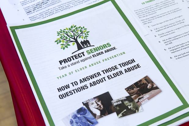 Information on elder abuse is shown at a Las Vegas Metro Police Department booth during a senior safety fair at the East Las Vegas Community Center, 250 North Eastern Ave., Tuesday, Oct. 15, 2013.