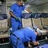 Southwest Airlines aircraft technicians install newer, skinnier seats on a 737 at the carrier's headquarters in Dallas, Sept. 23, 2013. 