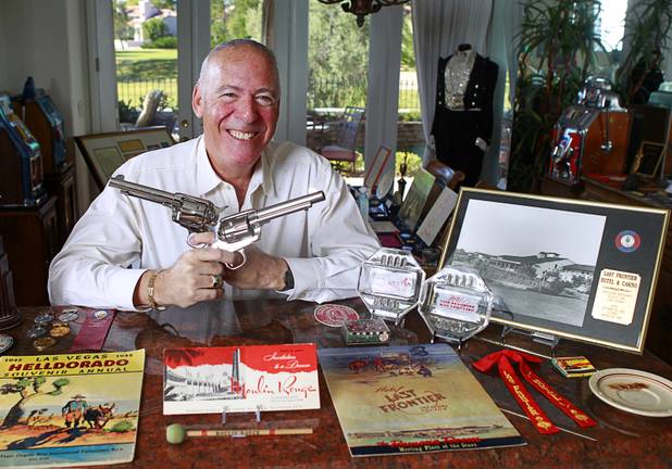 Steve Cutler poses with a small sampling of his collection of Las Vegas memorabilia at his home Wednesday, Oct. 16, 2013. The pistols were owned by entertainer Nelson Sardelli who included a gun-twirling performance in his act. Cutler, founder of Casino Legends Hall of Fame, used to display his collection in a museum at the Tropicana but is now looking for a new way to display the collection.