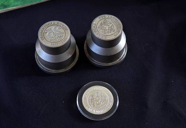 A die for making Lady Luck tokens, part of Steve Cutler's collection of Las Vegas memorabilia, is shown at Cutler's home Wednesday, Oct. 16, 2013. Cutler, founder of Casino Legends Hall of Fame, used to display his collection in a museum at the Tropicana but is now looking for a new way to display the collection.