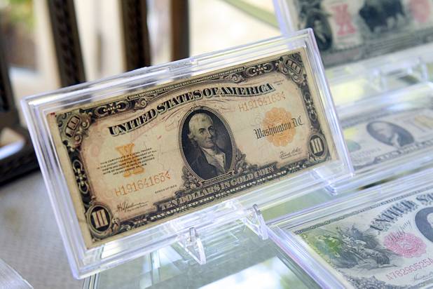 A ten dollar gold certificate, part of Steve Cutler's collection of Las Vegas memorabilia, is shown at Cutler's home Wednesday, Oct. 16, 2013. The bill features a portrait of Michael Hillegas, the first treasurer of the United States. Cutler, founder of Casino Legends Hall of Fame, used to display his collection in a museum at the Tropicana but is now looking for a new way to display the collection.