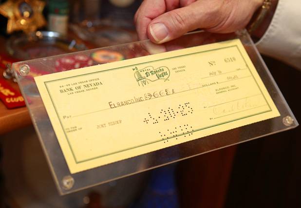 Steve Cutler holds a check from the El Rancho made out to Joey Bishop at Cutler's home Wednesday, Oct. 16, 2013. Cutler, founder of Casino Legends Hall of Fame, used to display his collection in a museum at the Tropicana but is now looking for a new way to display the collection.