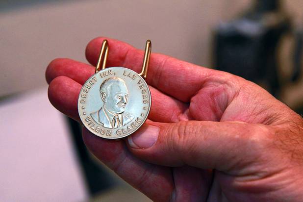 Steve Cutler displays a Wilbur Clark money clip at his home Wednesday, Oct. 16, 2013. Clark founded the Desert Inn casino (now the site of  Wynn Las Vegas) in 1950 and ran it until 1964. Cutler, founder of Casino Legends Hall of Fame, used to display his collection in a museum at the Tropicana but is now looking for a new way to display the collection.