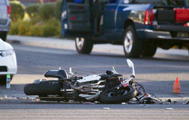 A damaged motorcycle is shown after a fatal accident on West Sahara Avenue near Buffalo Drive Wednesday, Oct. 16, 2013.