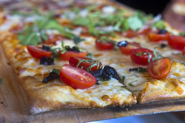 A Roman-style pizza is shown at the new Pizza Rock restaurant at Third Street and Ogden Avenue in downtown Las Vegas Thursday, Oct. 17 2013.