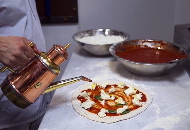 Tony Gemignani makes a margherita pizza at the new Pizza Rock restaurant at Third Street and Ogden Avenue in downtown Las Vegas Thursday, Oct. 17 2013.
