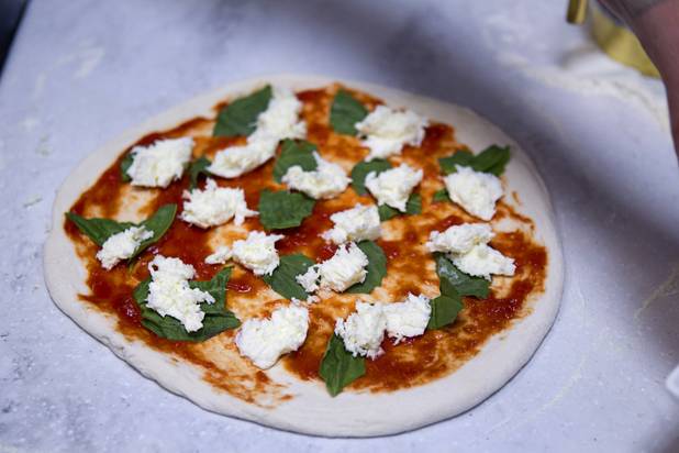 A margherita pizza made by Las Vegas Weekly food editor Brock Radke is shown before going into a wood-fired oven at the new Pizza Rock restaurant at Third Street and Ogden Avenue in downtown Las Vegas Thursday, Oct. 17 2013.