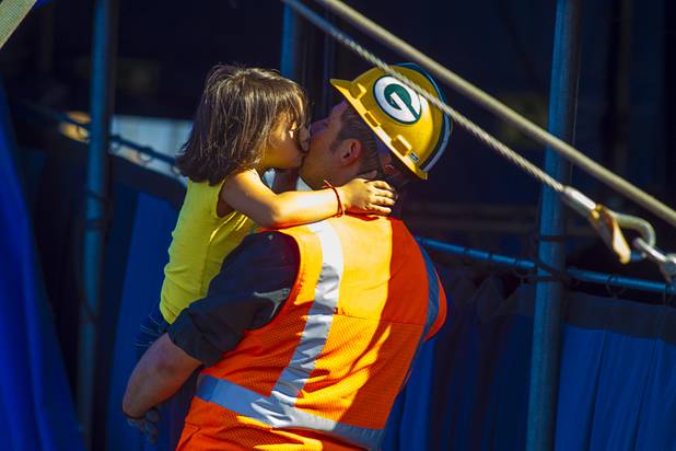 Matthew Esqueda gets a kiss from Gia Rivera, 5, as Circus Vargas members take the day to erect the big top at the Galleria on Sunset  Tuesday, Oct. 15, 2013.  L.E. Baskow.