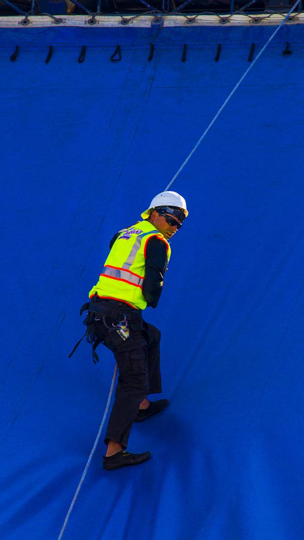 Eros Espana with Circus Vargas repels down the side of the big top after checking the rigging and lights as the tent is fully erected at the Galleria on Sunset Tuesday, Oct. 15, 2013.  L.E. Baskow.