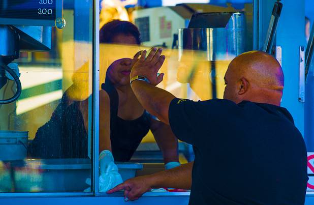 Jose Velasquez helps to get the concession stand clean and ready for business as Circus Vargas takes up temporary residence at the Galleria on Sunset Tuesday, Oct. 15, 2013.  L.E. Baskow.