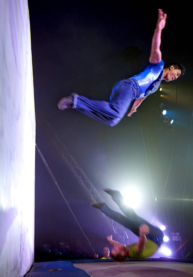 Circus Vargas acrobats Victor Kim (top) and Chris Ries twist and tumble off the Tramp-O Wall during the opening night performance at the Galleria on Sunset  Thursday, Oct. 17, 2013.  L.E. Baskow.