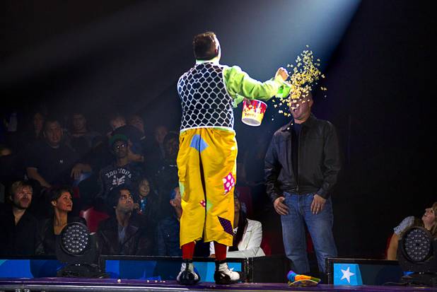 Circus Vargas clown Matti Esqueda tosses popcorn on surprised audience member Jeremy Greenwell during the opening night performance at the Galleria on Sunset  Thursday, Oct. 17, 2013.  .L.E. Baskow.