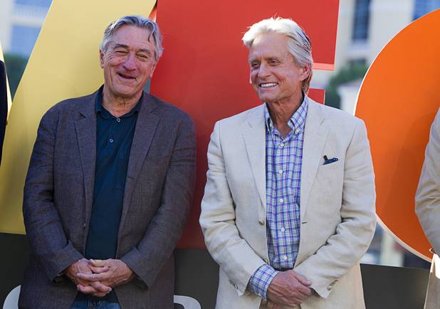 Actors Robert De Niro and Michael Douglas chat during a ceremony for cast members of "Last Vegas" and director Jon Turteltaub in front of the Bellagio on Friday, Oct. 18, 2013. Mayor Carolyn Goodman and Clark County Commission Chairman Steve Sisolak declared Oct. 18, 2013, as "Last Vegas Day" in Las Vegas and Clark County. The movie by CBS Films opens nationwide Nov. 1.