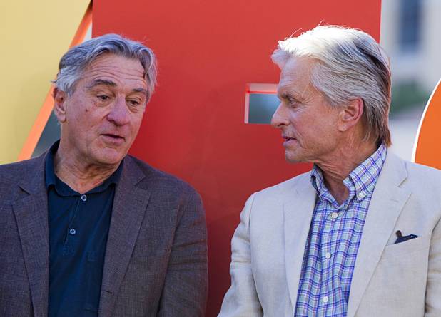 Actors Robert De Niro, left, and Michael Douglas chat during a ceremony for cast members of "Last Vegas" and director Jon Turteltaub in front of the Bellagio Friday, Oct. 18, 2013. Las Vegas Mayor Carolyn Goodman and Clark County Commission Chairman Steve Sisolak declared Oct. 18, 2013 to be "Last Vegas Day" in Las Vegas and Clark County. The movie by CBS Films opens nationwide on November 1.
