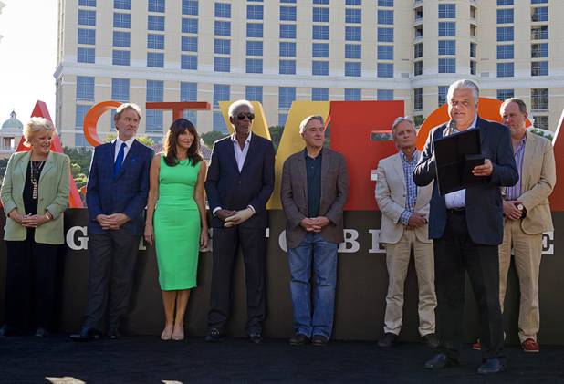 Clark County Commission Chairman Steve Sisolak, right, reads a proclamation for cast members of "Last Vegas" and director Jon Turteltaub during a ceremony in front of the Bellagio Friday, Oct. 18, 2013. From left: Las Vegas Mayor Carolyn Goodman and actors Kevin Kline, Mary Steenburgen, Morgan Freeman, Robert De Niro, Michael Douglas and director Jon Turteltaub. Sisolak and Goodman declared Oct. 18, 2013 to be "Last Vegas Day" in Las Vegas and Clark County. The movie by CBS Films opens nationwide on November 1.