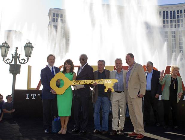 Cast members of "Last Vegas" and director Jon Turteltaub, right, pose in front of a Bellagio hotel-casino fountain show in Las Vegas, Nevada Oct. 18, 2013. Actors from left: Kevin Kline, Mary Steenburgen, Morgan Freeman, Robert De Niro, and Michael Douglas. Las Vegas Mayor Carolyn Goodman (far right) and Clark County Commission Chairman Steve Sisolak declared Oct. 18, 2013 to be "Last Vegas Day" in Las Vegas and Clark County. The movie by CBS Films opens nationwide on November 1.