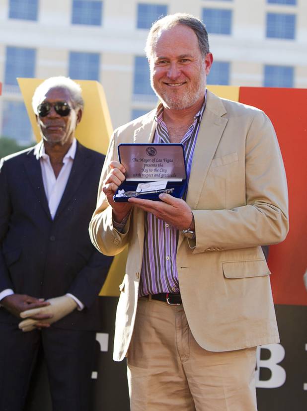 Director Jon Turteltaub poses with the Key to the City during a ceremony for Turteltaub and cast members of "Last Vegas" in front of the Bellagio Friday, Oct. 18, 2013. Behind Turteltaub is actor Morgan Freeman. Las Vegas Mayor Carolyn Goodman and Clark County Commission Chairman Steve Sisolak declared Oct. 18, 2013 to be "Last Vegas Day" in Las Vegas and Clark County. The movie by CBS Films opens nationwide on November 1.