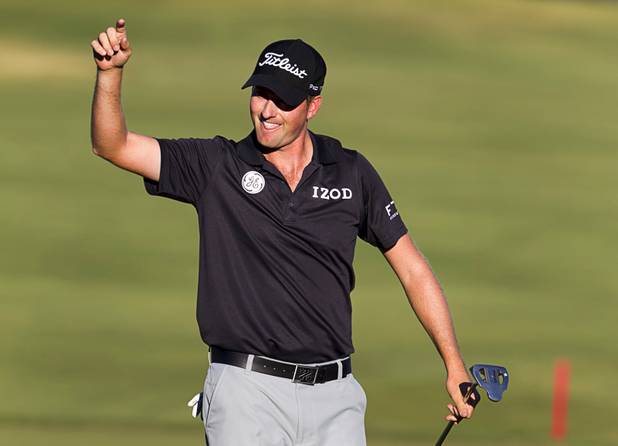 Webb Simpson of Charlotte, N.C. celebrates after making a birdie on the 18th hole and winning the Shriners Hospitals for Children Open at TPC Summerlin Sunday Oct. 20, 2013.