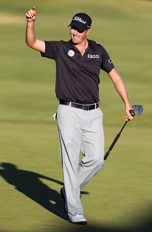 Webb Simpson of Charlotte, N.C. celebrates after sinking his birdie putt on the 18th green during the Shriners Hospital for Children Open at TPC Summerlin Sunday Oct. 20, 2013. Simpson ties tourney record to win Shriners Open by six strokes.