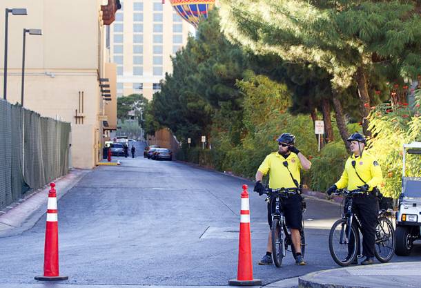 Hotel security officers guard an access road behind Planet Hollywood  after an employee discovered a dead baby in a trash bin outside the hotel Monday, Oct. 21, 2013.