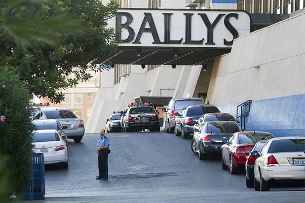 Metro Police cars are shown in front of Bally's after an early morning shooting that killed one person and wounded two others in Drai's, a nightclub inside Bally's, Monday, Oct. 21, 2013.  A suspect is reported in custody.