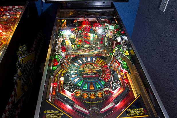 A "High Speed" pinball machine by Williams is shown in Craig Snelling's game room Tuesday, Oct. 22, 2013. Snelling is a pinball machine repairman and owner of Billiards 'N More, a billiards and game room supply store.