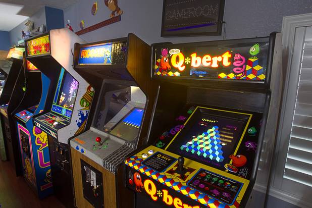 Arcade games are shown in Craig Snelling's game room Tuesday, Oct. 22, 2013. Snelling is a pinball machine repairman and owner of Billiards 'N More, a billiards and game room supply store.