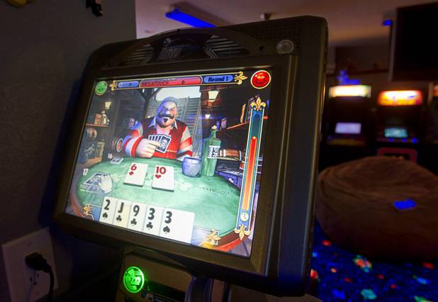 A bar game is shown in Craig Snelling's game room Tuesday, Oct. 22, 2013. Snelling is a pinball machine repairman and owner of Billiards 'N More, a billiards and game room supply store.