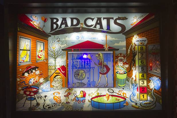A Williams  "Bad Cats" pinball machine is shown in Craig Snelling's game room Tuesday, Oct. 22, 2013.