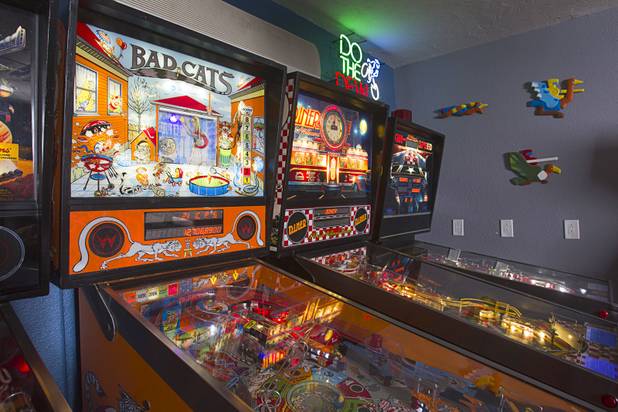 A Williams  "Bad Cats" pinball machine is shown in Craig Snelling's game room Tuesday, Oct. 22, 2013.