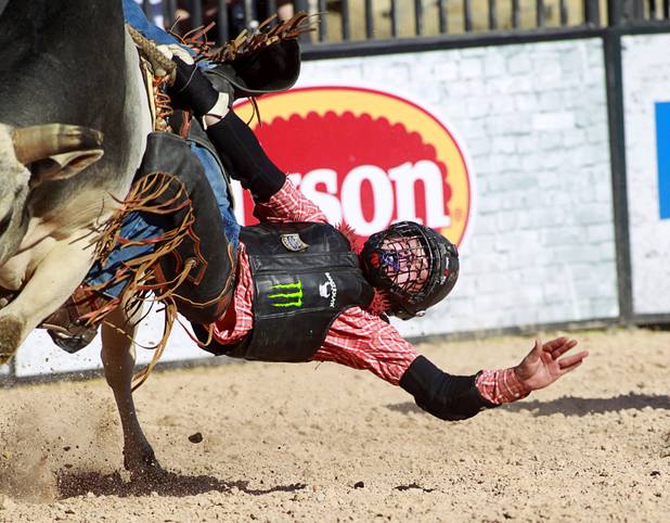 Senior rider Hunter Ray of Kolin. La. hangs onto his bull for a successful ride during the Chris Shivers Miniature Bull Riding (MBR) World Finals at Mandalay Bay Thursday, Oct. 24, 2013. The MBR features junior riders ages 8 to11 and senior riders ages 12 to 14. The event was part of the the 2013 Professional Bull Riders Built Ford Tough World Finals.