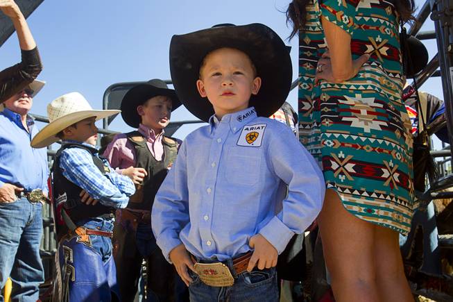 Blayne Shivers, 6, son of professional bull rider Chris Shivers, waits for the start of the Chris Shivers Miniature Bull Riding (MBR) World Finals at Mandalay Bay Thursday, Oct. 24, 2013. Blayne competed in the Mutton Busting. The MBR features junior riders ages 8 to11 and senior riders ages 12 to 14. The event was part of the the 2013 Professional Bull Riders Built Ford Tough World Finals.