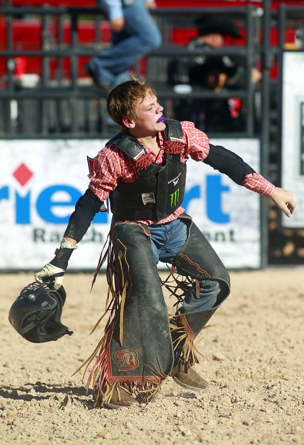Senior rider Hunter Ray of Kolin. La. celebrates a successful ride during the Chris Shivers Miniature Bull Riding (MBR) World Finals at Mandalay Bay Thursday, Oct. 24, 2013. The MBR features junior riders ages 8 to11 and senior riders ages 12 to 14. The event was part of the the 2013 Professional Bull Riders Built Ford Tough World Finals.