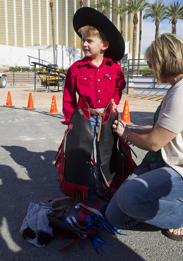 AJ Rupp, 4, of Polk City, Iowa gets ready for a Mutton Bustin' competition at the Tyson Fan Zone & Marketplace at Mandalay Bay Thursday, Oct. 24, 2013. The event was part of the the 2013 Professional Bull Riders Built Ford Tough World Finals.