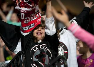 A young Wranglers fan dances to the music during a stoppage in play between Las Vegas and the Alaska Aces on Friday night at the Orleans Arena.