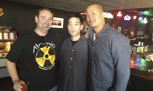 At the media center, which doubles as The Atomic, Andy Hsieh, 37, center, the brother of Zappos CEO Tony Hsieh, and David Louie, 37, right, pose with Lance Johns, co-owner of the bar. Hsieh is CEO/founder of Lux Delux, a mobile app that simplifies ordering from downtown restaurants. It also is supporting the Life is Beautiful festival. Text “LUX” to 702-800-6826 to download the app to your iPhone.